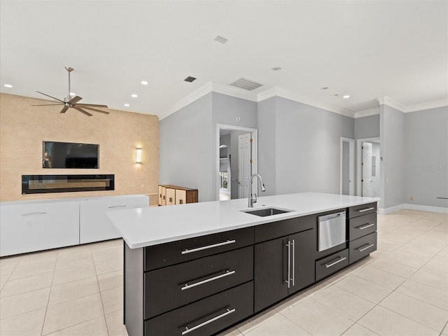 713 Argyle Pl, Temple Terrace, FL 33617 - kitchen featuring open floor plan, light tile patterned floors, a ceiling fan, light countertops, and dark cabinetry