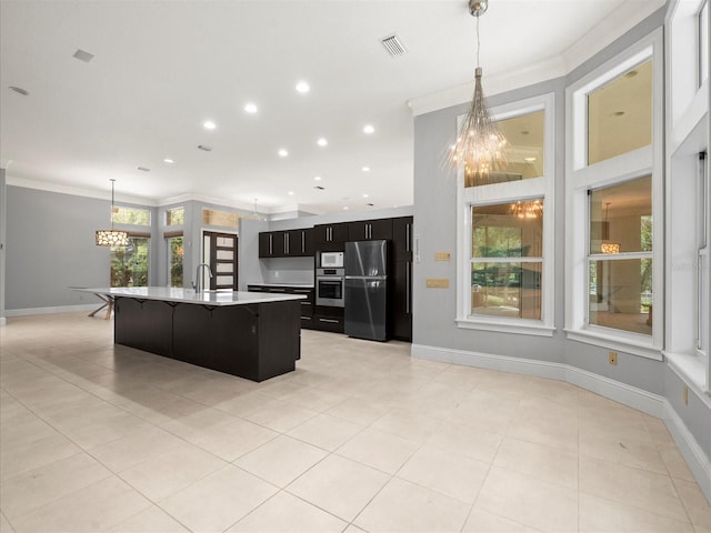 713 Argyle Pl, Temple Terrace, FL 33617 - kitchen with appliances with stainless steel finishes, a chandelier, crown molding, light countertops, and dark cabinetry