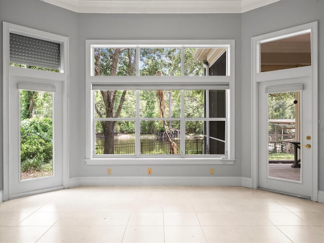 713 Argyle Pl, Temple Terrace, FL 33617 - unfurnished room with healthy amount of natural light, tile patterned floors, and crown molding
