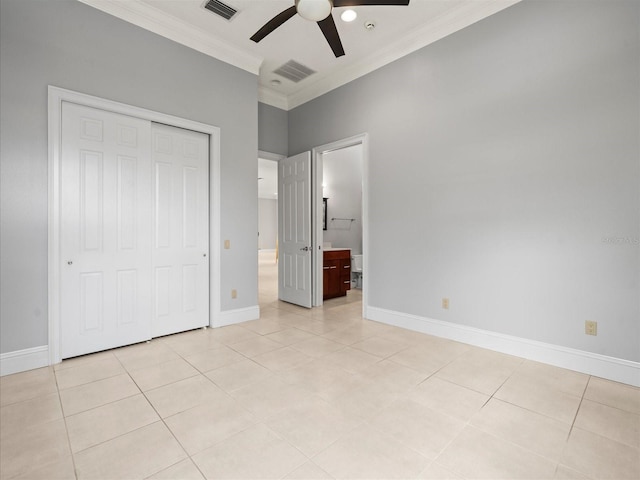 713 Argyle Pl, Temple Terrace, FL 33617 - unfurnished bedroom featuring ornamental molding, a closet, light tile patterned flooring, ceiling fan, and connected bathroom