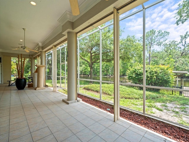 713 Argyle Pl, Temple Terrace, FL 33617 - unfurnished sunroom featuring tile patterned flooring, view of wooded area, crown molding, and recessed lighting