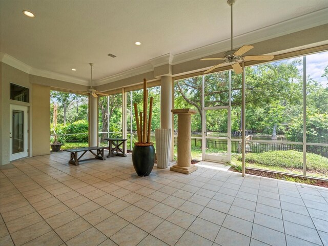 713 Argyle Pl, Temple Terrace, FL 33617 - unfurnished sunroom featuring healthy amount of natural light, view of wooded area, and a water view