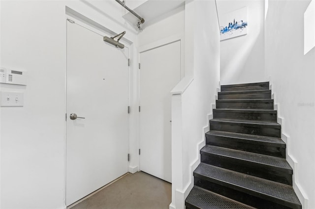 5008 S Macdill Ave Unit 16, Tampa, FL 33611 - stairs with finished concrete floors