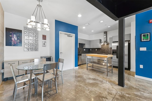 5008 S Macdill Ave Unit 16, Tampa, FL 33611 - dining room featuring a chandelier, finished concrete floors, and recessed lighting