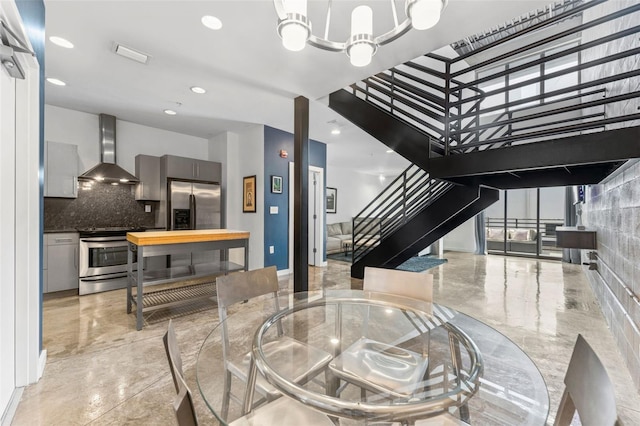 5008 S Macdill Ave Unit 16, Tampa, FL 33611 - dining area with stairs, light marble finish floors, recessed lighting, and a chandelier