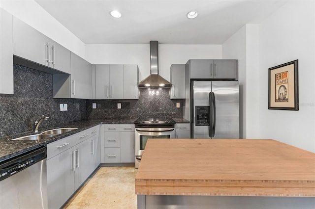5008 S Macdill Ave Unit 16, Tampa, FL 33611 - kitchen with wall chimney range hood, appliances with stainless steel finishes, gray cabinets, backsplash, and recessed lighting