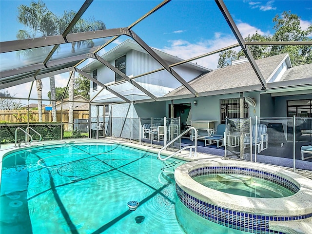 1906 White Cedar Way, Brandon, FL 33511 - view of swimming pool featuring a patio area, glass enclosure, and a pool with connected hot tub