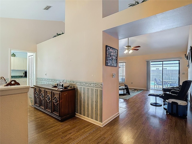 1906 White Cedar Way, Brandon, FL 33511 - hallway featuring wood finished floors, a towering ceiling, and wainscoting
