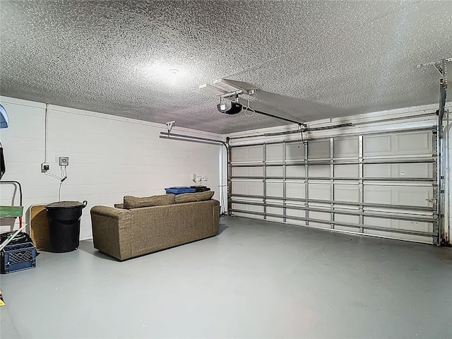 1906 White Cedar Way, Brandon, FL 33511 - garage featuring a garage door opener and concrete block wall