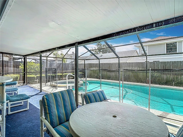 1906 White Cedar Way, Brandon, FL 33511 - view of swimming pool with a fenced backyard, glass enclosure, a patio, and a pool with connected hot tub