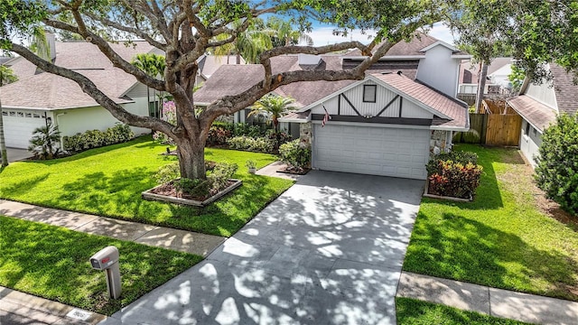 1906 White Cedar Way, Brandon, FL 33511 - view of front of house featuring an attached garage, driveway, a residential view, and roof with shingles