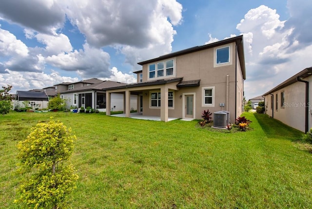 11035 Sage Canyon Dr, Riverview, FL 33578 - rear view of house with a patio, stucco siding, and a lawn