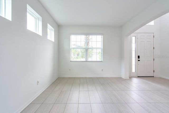 11035 Sage Canyon Dr, Riverview, FL 33578 - entryway with baseboards and light tile patterned floors