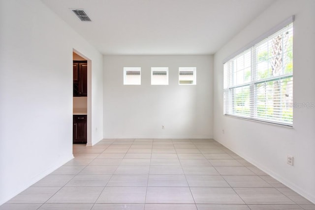 11035 Sage Canyon Dr, Riverview, FL 33578 - empty room with light tile patterned floors and baseboards