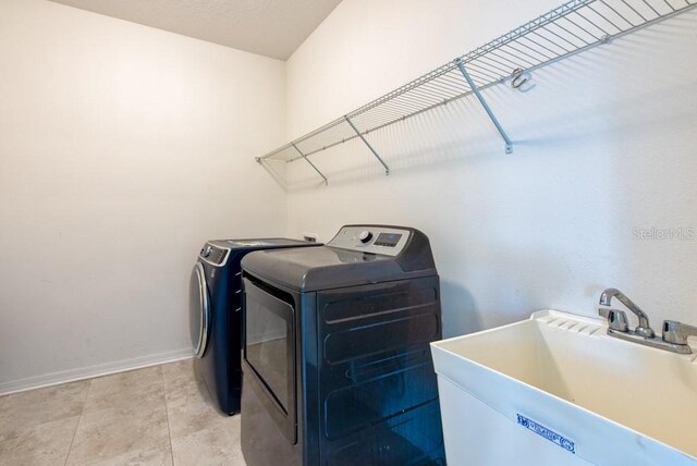 11035 Sage Canyon Dr, Riverview, FL 33578 - washroom featuring independent washer and dryer and baseboards