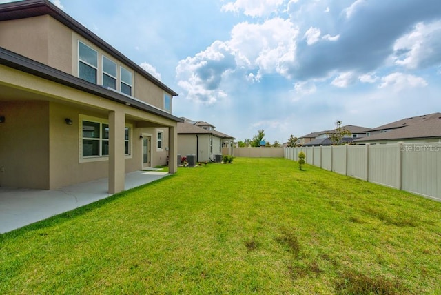 11035 Sage Canyon Dr, Riverview, FL 33578 - fenced backyard with a patio area