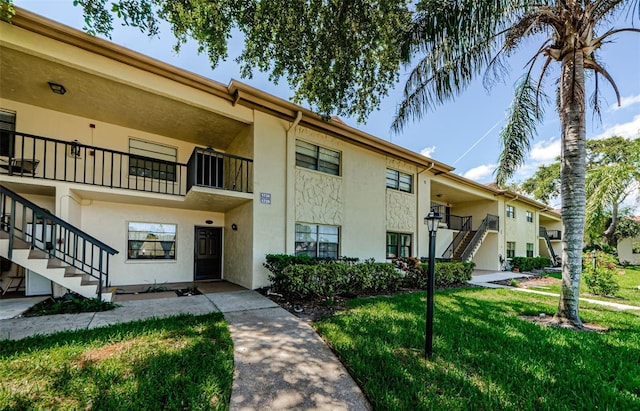 1729 Seascape Cir Unit 102, Tarpon Springs, FL 34689 - view of property featuring stairs