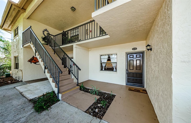 1729 Seascape Cir Unit 102, Tarpon Springs, FL 34689 - property entrance featuring stucco siding