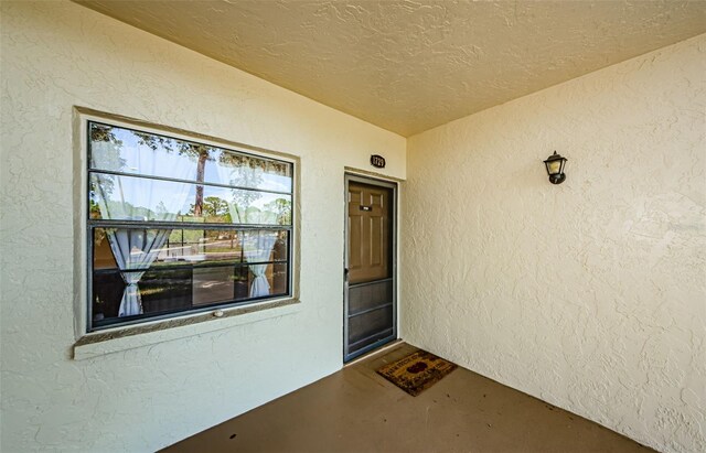 1729 Seascape Cir Unit 102, Tarpon Springs, FL 34689 - view of exterior entry featuring stucco siding