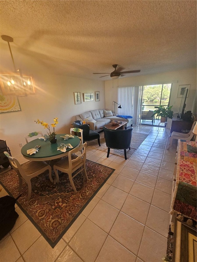 1729 Seascape Cir Unit 102, Tarpon Springs, FL 34689 - living room featuring light tile patterned floors, a textured ceiling, and ceiling fan