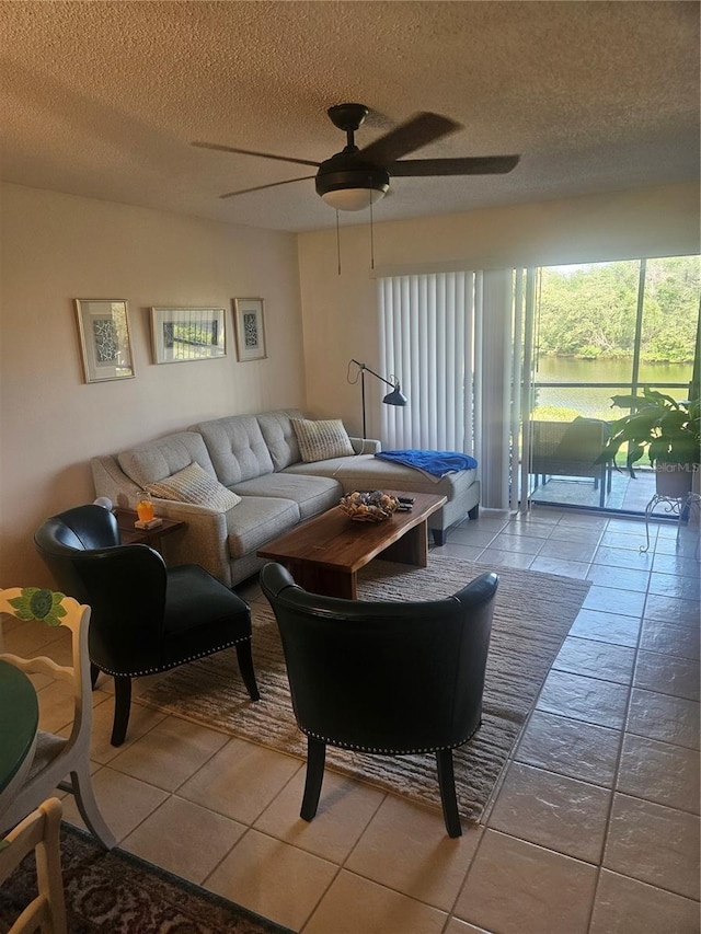 1729 Seascape Cir Unit 102, Tarpon Springs, FL 34689 - tiled living area featuring a textured ceiling and ceiling fan