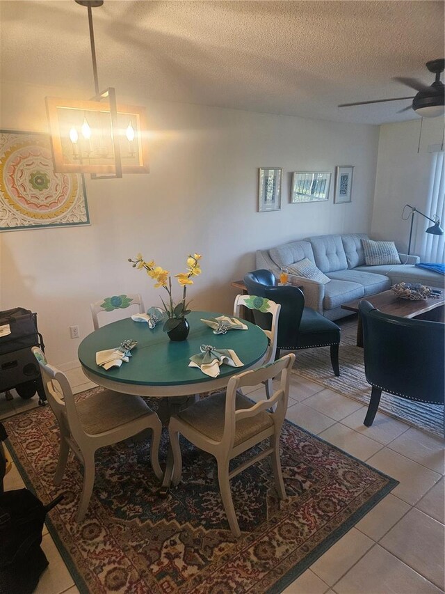 1729 Seascape Cir Unit 102, Tarpon Springs, FL 34689 - dining room with a textured ceiling, light tile patterned floors, and a ceiling fan