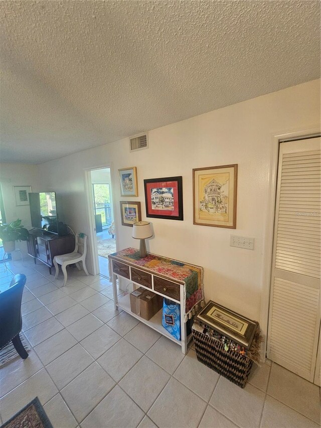 1729 Seascape Cir Unit 102, Tarpon Springs, FL 34689 - interior space with tile patterned flooring and a textured ceiling