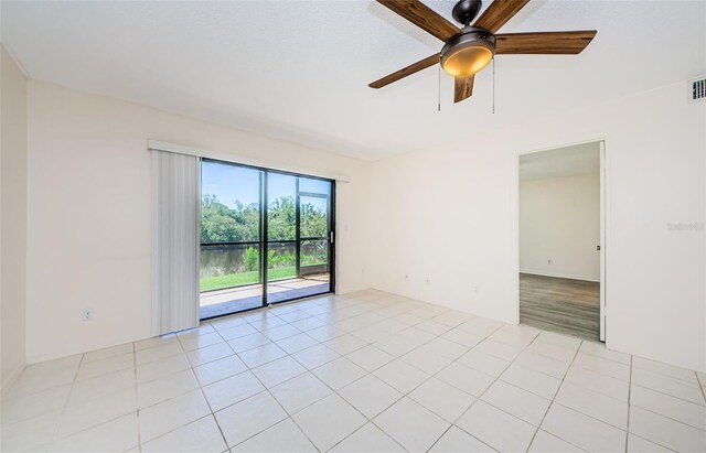 1729 Seascape Cir Unit 102, Tarpon Springs, FL 34689 - empty room with a ceiling fan and light tile patterned floors