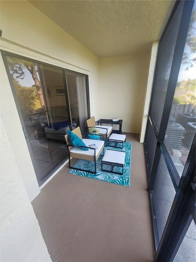 1729 Seascape Cir Unit 102, Tarpon Springs, FL 34689 - balcony featuring an outdoor living space
