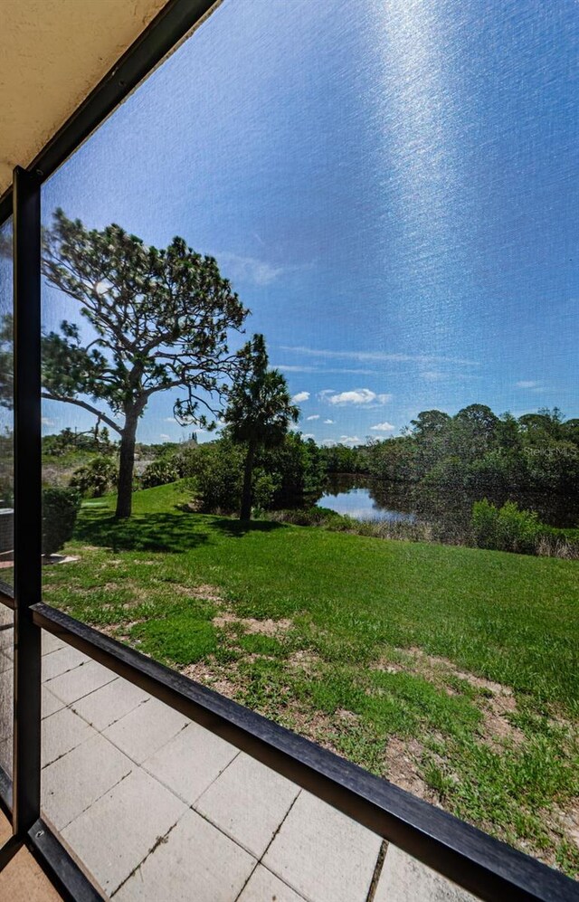 1729 Seascape Cir Unit 102, Tarpon Springs, FL 34689 - view of grassy yard with a water view