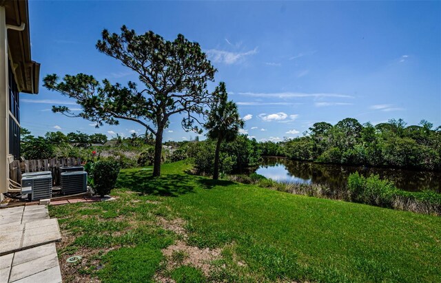 1729 Seascape Cir Unit 102, Tarpon Springs, FL 34689 - view of grassy yard featuring a water view