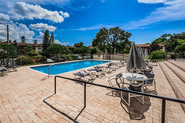 1729 Seascape Cir Unit 102, Tarpon Springs, FL 34689 - community pool with a patio