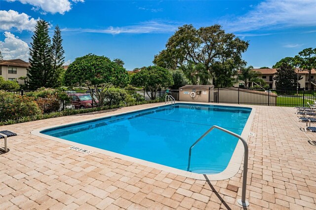 1729 Seascape Cir Unit 102, Tarpon Springs, FL 34689 - community pool with a patio area