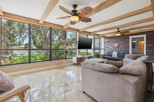10730 52nd Ave N, Saint Petersburg, FL 33708 - sunroom featuring ceiling fan, an outdoor hangout area, beam ceiling, and healthy amount of natural light