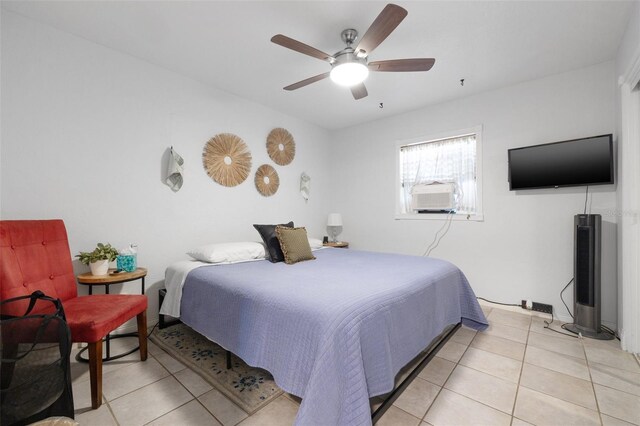 10730 52nd Ave N, Saint Petersburg, FL 33708 - bedroom featuring light tile patterned flooring, cooling unit, and ceiling fan