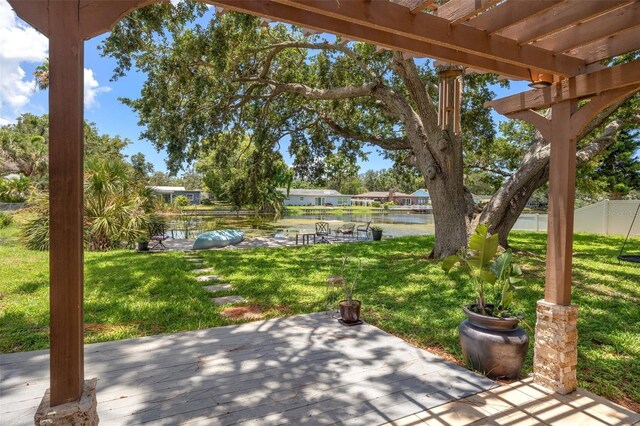 10730 52nd Ave N, Saint Petersburg, FL 33708 - view of patio / terrace featuring a pergola and a deck with water view