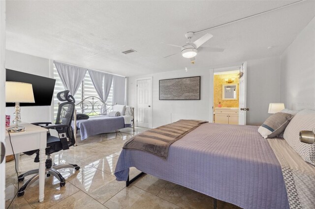 10730 52nd Ave N, Saint Petersburg, FL 33708 - bedroom with a desk, a ceiling fan, and connected bathroom