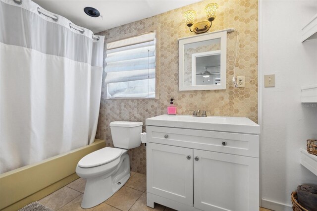10730 52nd Ave N, Saint Petersburg, FL 33708 - bathroom featuring vanity, tile patterned flooring, and shower / tub combo with curtain