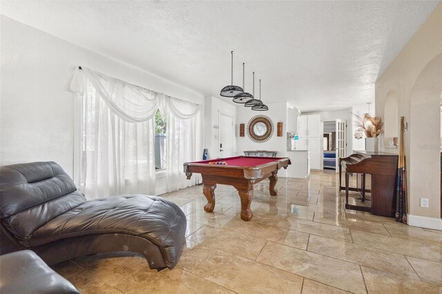 10730 52nd Ave N, Saint Petersburg, FL 33708 - game room featuring arched walkways, billiards, and a textured ceiling
