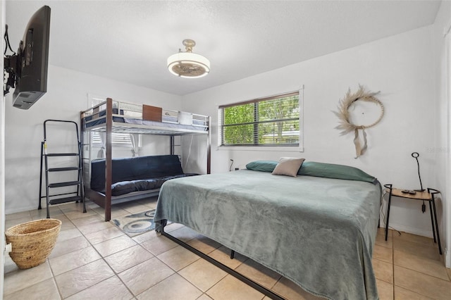 10730 52nd Ave N, Saint Petersburg, FL 33708 - bedroom featuring light tile patterned flooring and baseboards