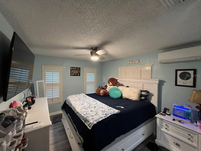 6531 Seaview Blvd, Hudson, FL 34667 - bedroom with an AC wall unit, a textured ceiling, dark wood-type flooring, and a ceiling fan