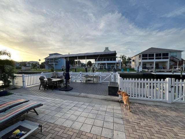 6531 Seaview Blvd, Hudson, FL 34667 - view of patio / terrace with outdoor dining area and a deck with water view