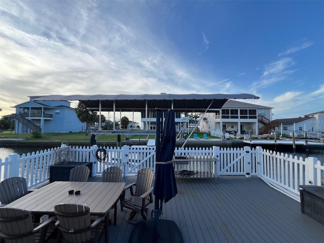6531 Seaview Blvd, Hudson, FL 34667 - wooden deck featuring a water view and outdoor dining space