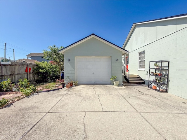 detached garage with concrete driveway