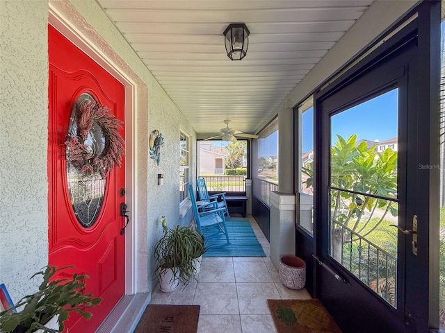 entrance to property with stucco siding and a porch