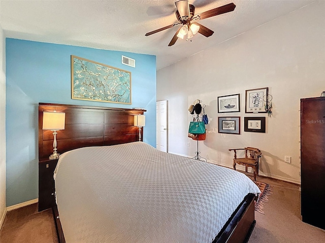 carpeted bedroom featuring a ceiling fan and vaulted ceiling
