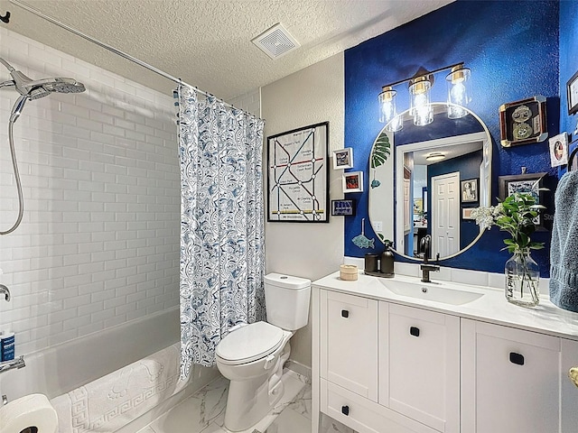 bathroom with vanity, shower / bath combination with curtain, a textured ceiling, and marble finish floors