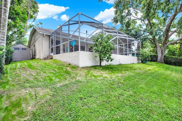 2454 Shadecrest Rd, Land O Lakes, FL 34639 - back of house with a storage shed, stucco siding, a yard, and glass enclosure