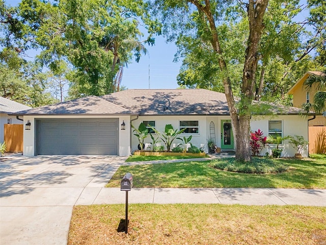 1313 W Carissa Ct, Tampa, FL 33604 - single story home featuring a garage, driveway, and stucco siding