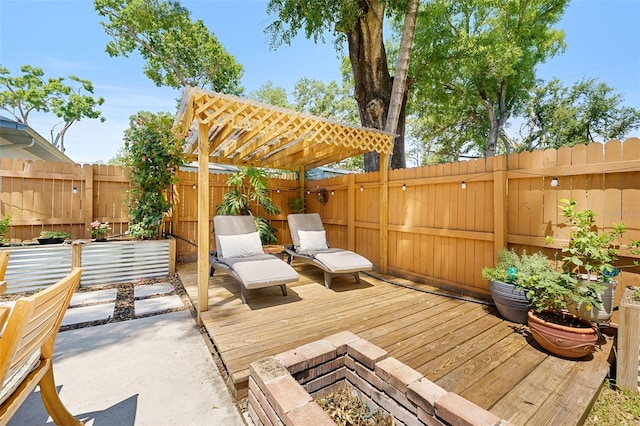 1313 W Carissa Ct, Tampa, FL 33604 - wooden terrace featuring an outdoor fire pit and a fenced backyard